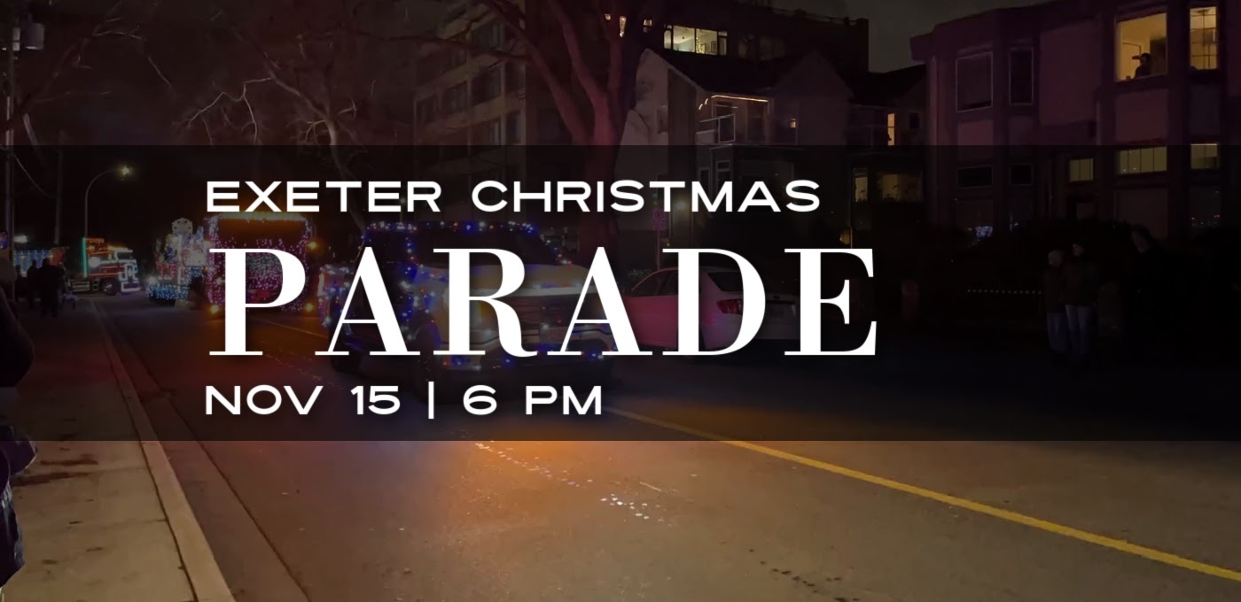 dark nighttime picture with trucks and white lettering black faded banner