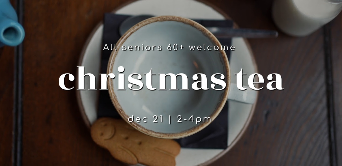 gingerbread cookie and a tea cup white lettering