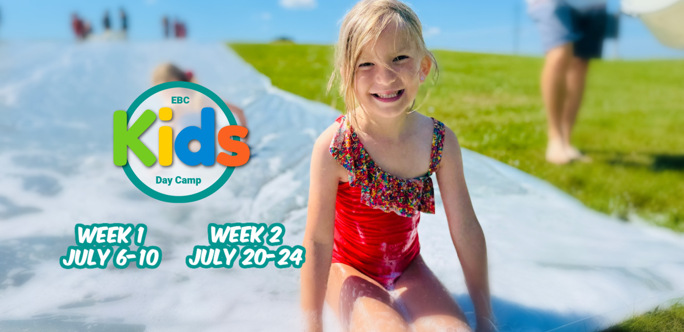 girl in a red bathing suit on a slip and slide with white and teal lettering EBC kids logo