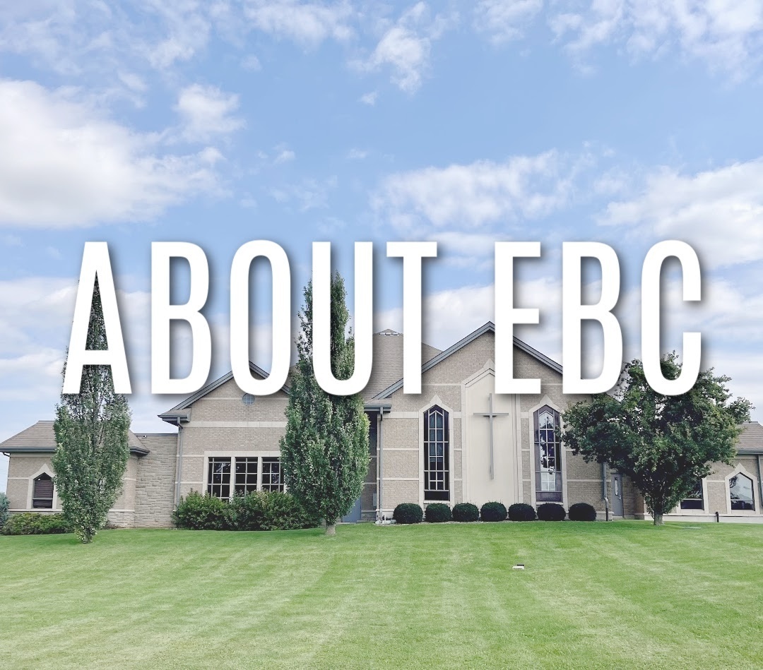 church with white fluffy clouds blue sky green grass white lettering