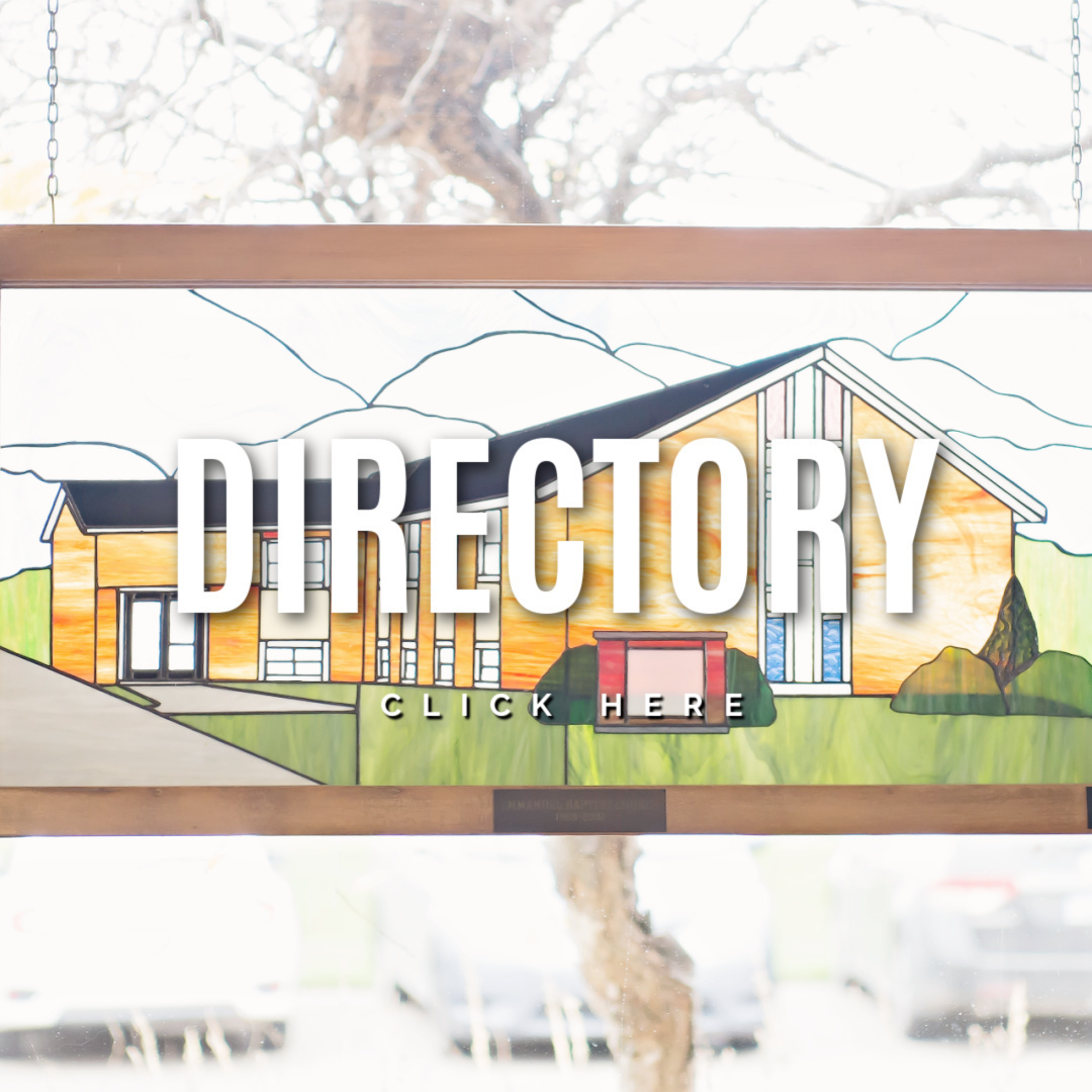 stained glass window with church building white lettering