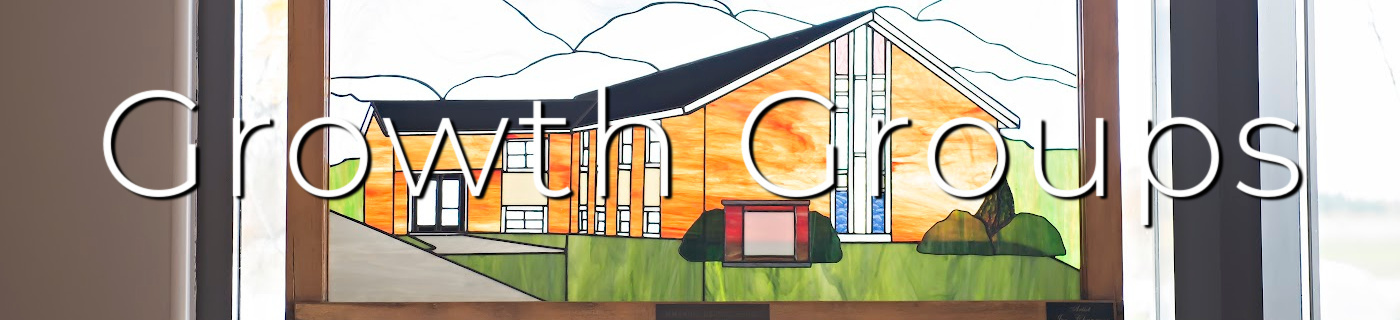 stained glass window of a church building, white lettering